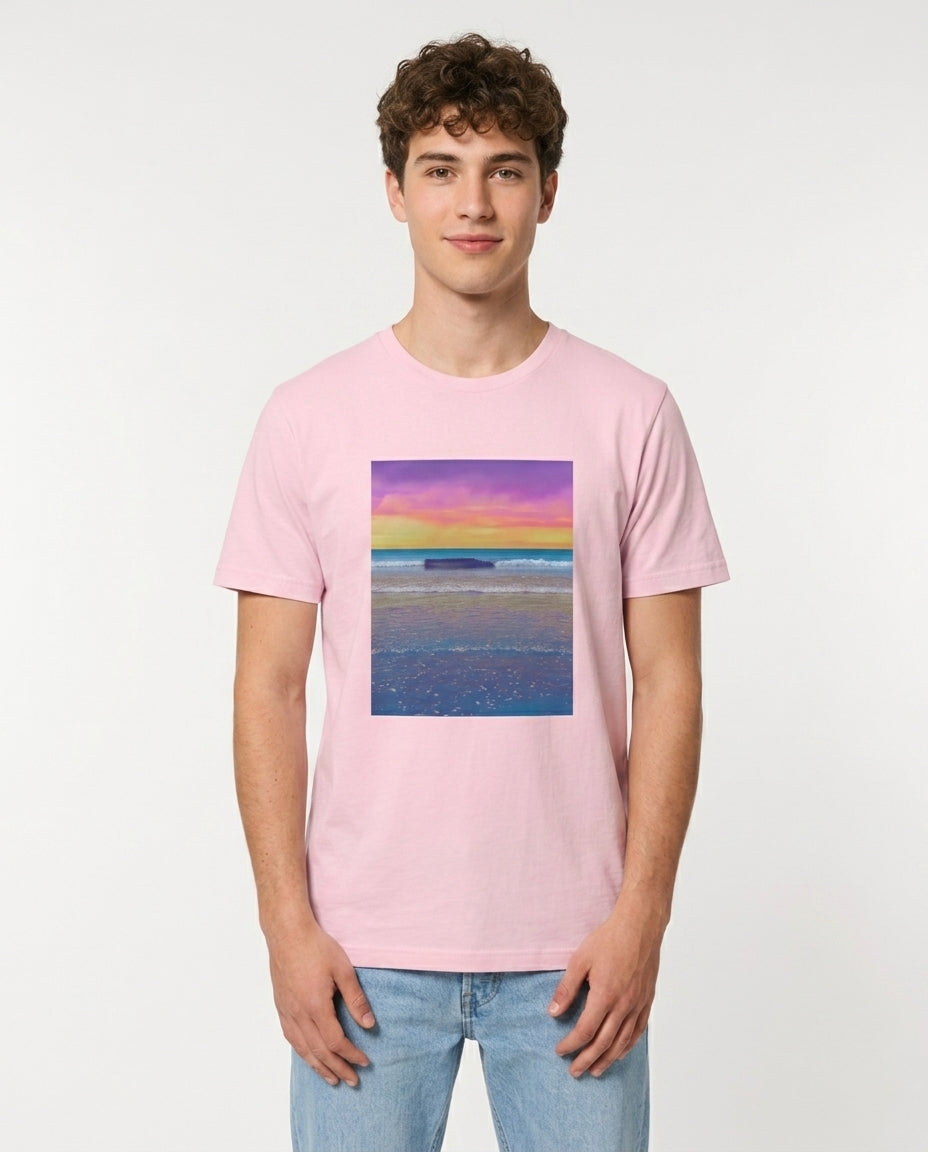 Male model wearing Pink t-shirt with a colorful beach scene print on a white background
