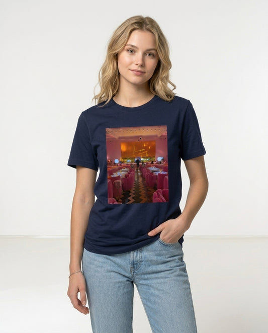 Person wearing a navy blue t-shirt with a graphic design on a white background