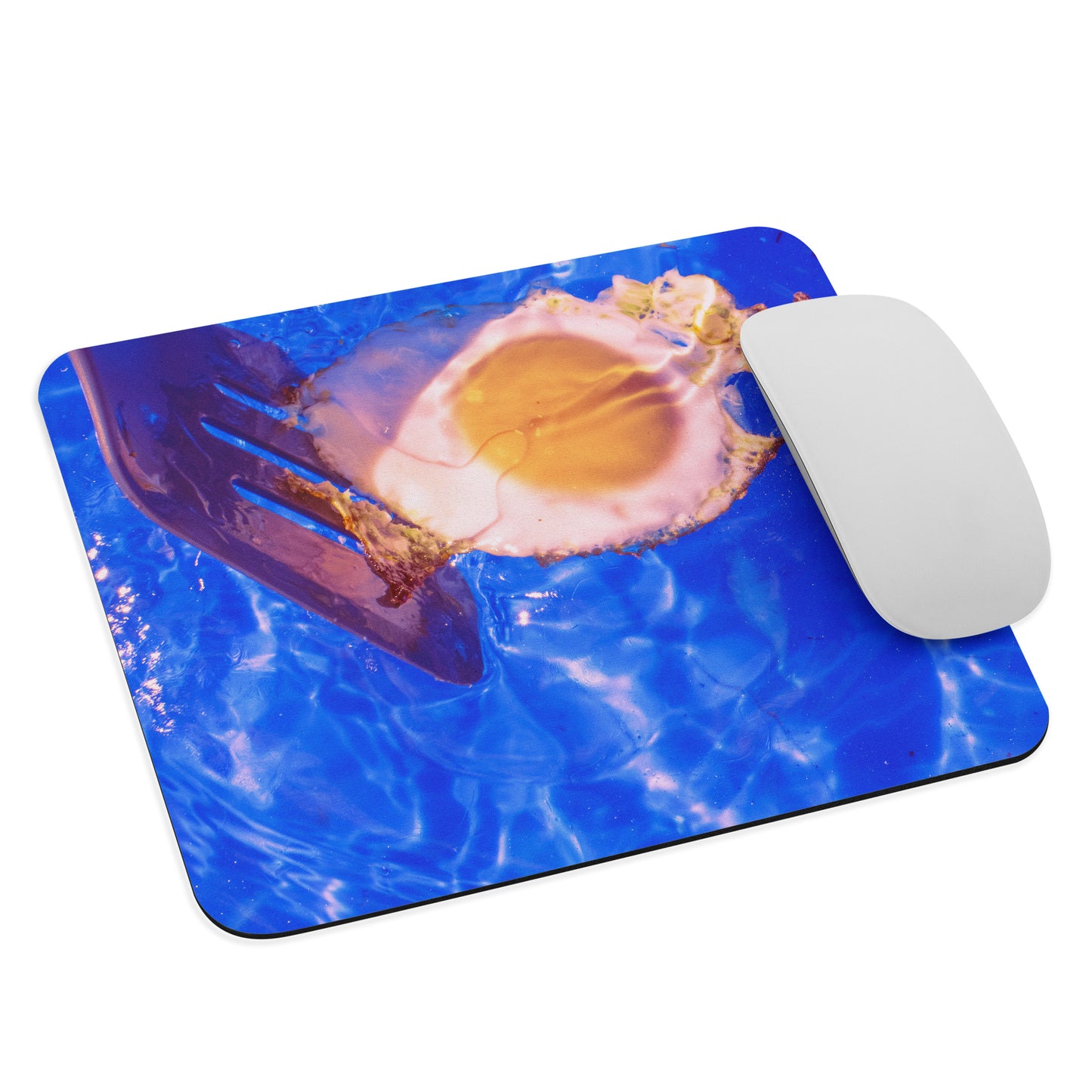Mouse pad with a fried egg floating on water design with a mouse on top.