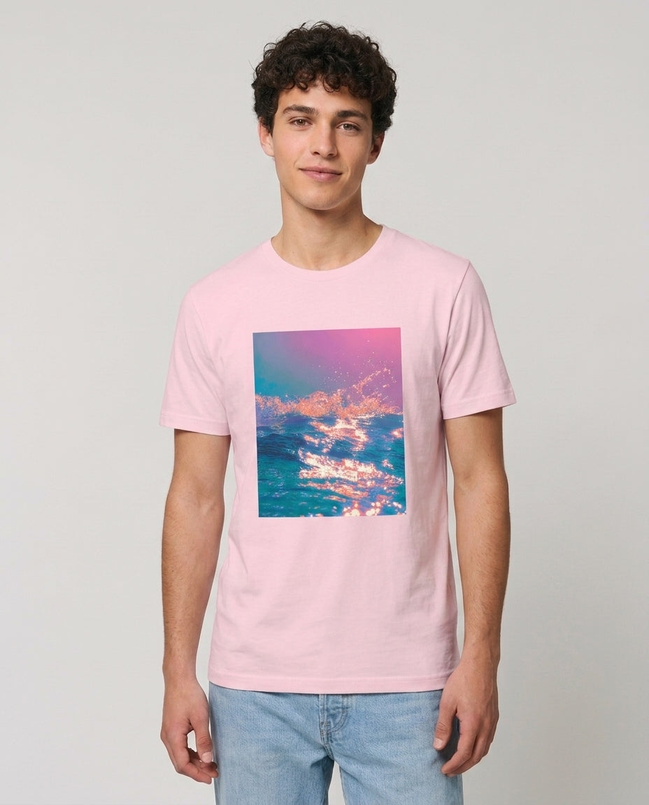 Person wearing a pink t-shirt with a colorful cloud design on a plain background