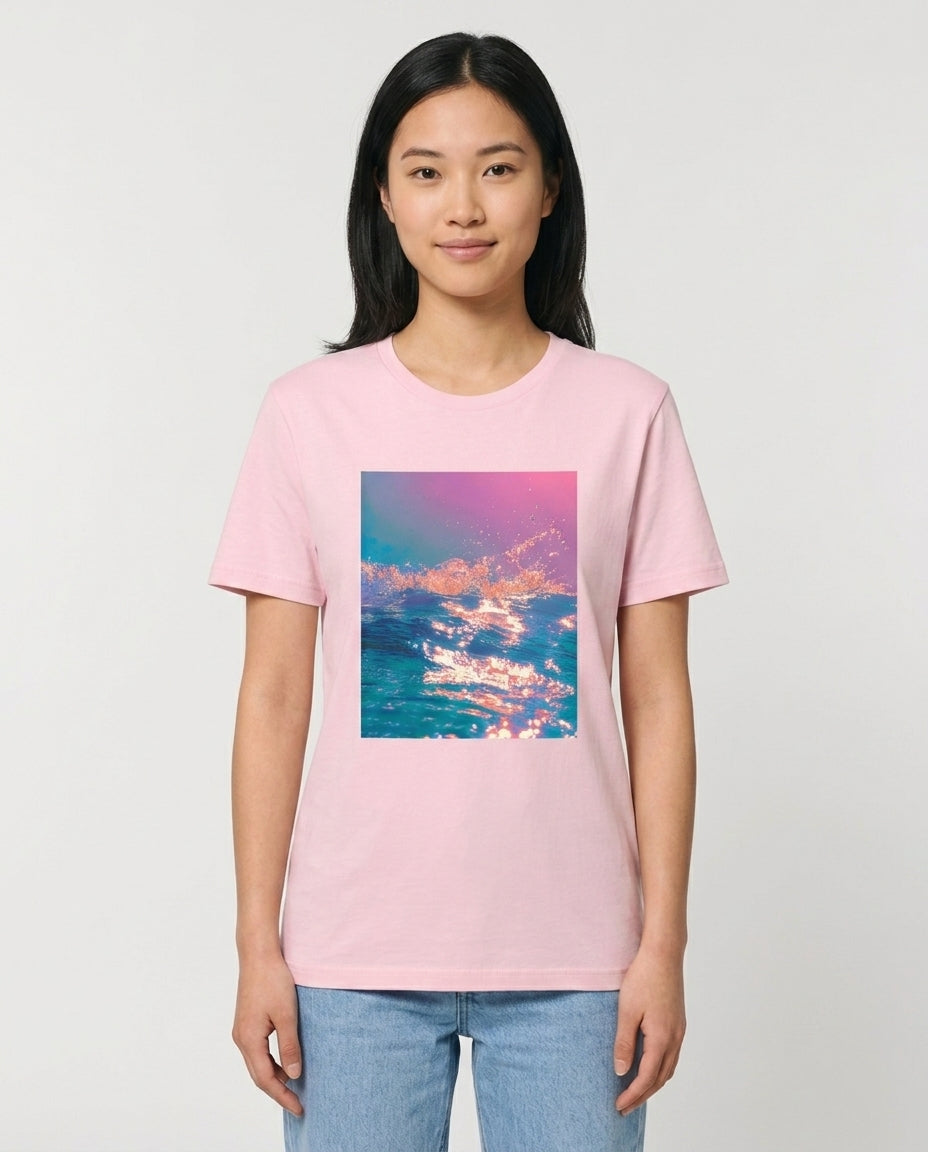 Person wearing a pink t-shirt with a colorful cloud design on a plain background