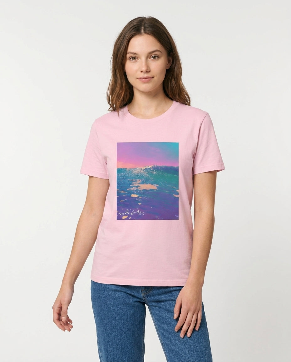 Person wearing a pink t-shirt with a colorful graphic design on a white background