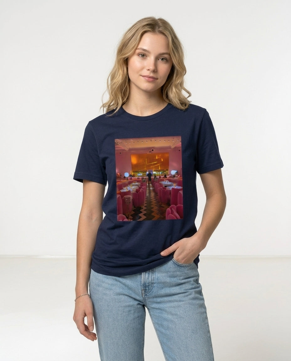 Person wearing a navy blue t-shirt with a graphic design on a white background