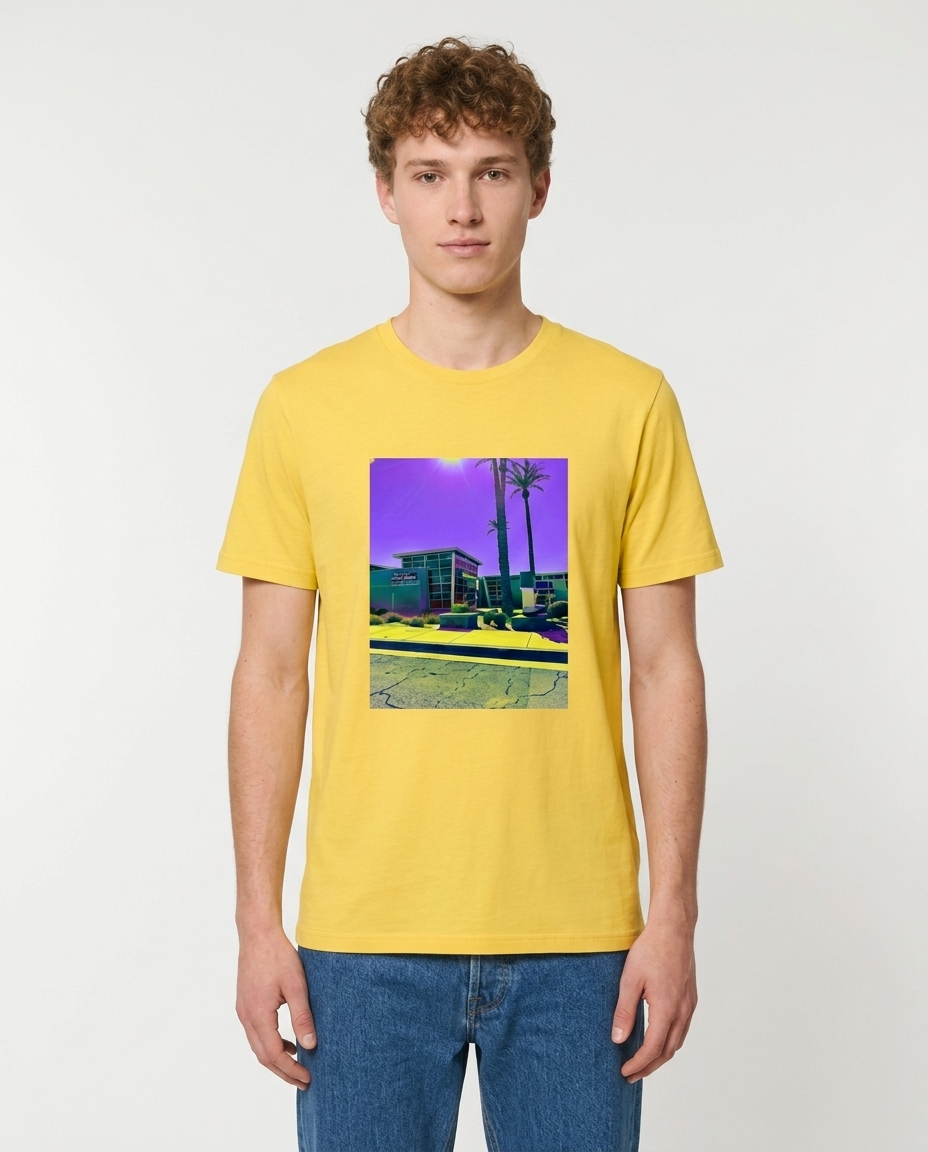 Person wearing a yellow t-shirt with a graphic design on a plain background