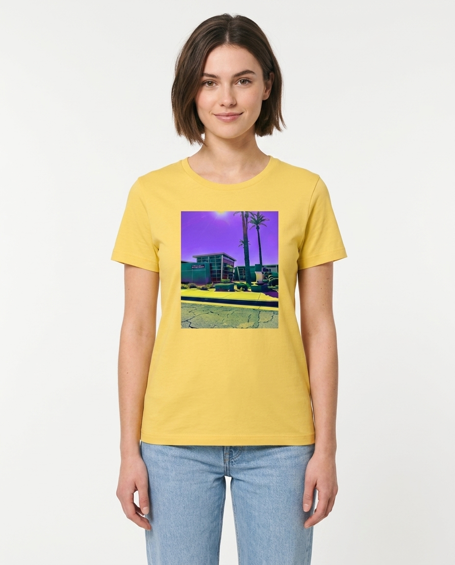Person wearing a yellow t-shirt with a graphic design on a plain background