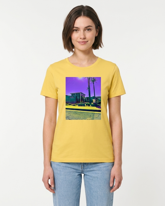 Person wearing a yellow t-shirt with a graphic design on a plain background