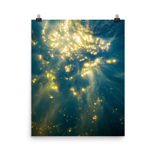 fine art poster print of abstract underwater sunlight, gold light particles scattered across deep teal ocean water, cosmic seascape wall art displayed on a white wall