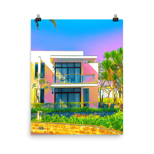 Unframed fine art poster print of a modernist villa, pink and yellow facade with glass balcony against a blue-to-violet gradient sky, tropical garden setting.