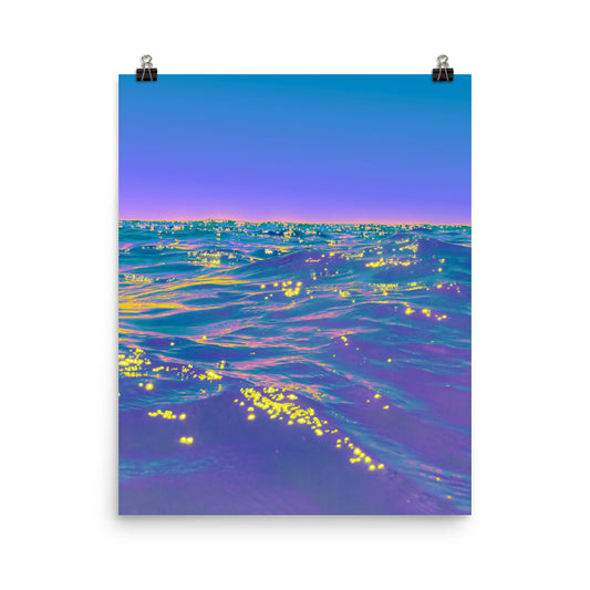 Unframed fine art ocean photography print, deep purple and teal sea surface scattered with vivid gold light reflections, lavender sky at horizon, coastal wall art