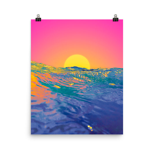 Unframed fine art poster print of an ocean sunset at water level, large golden sun setting on the horizon against a vivid pink and orange sky, foreground waves in deep blue and teal with golden reflections, wall art print