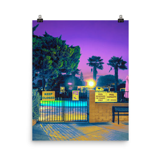 Unframed fine art photography poster print of a retro American pool gate at twilight, featuring electric purple sky, glowing amber light, teal-lit pool water, and palm tree silhouettes in yellow and deep blue tones, with vintage yellow pool signs reading Keep Closed and Pool Reserved for Tenants Only.​​​​​​​​​​​​​​​​