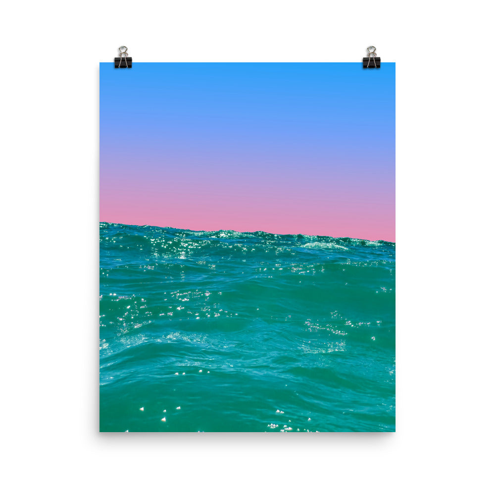 Fine art ocean print showing sunlit teal waves from water level with a soft pink and blue gradient sky — unframed archival print by Nathan Head Photography.