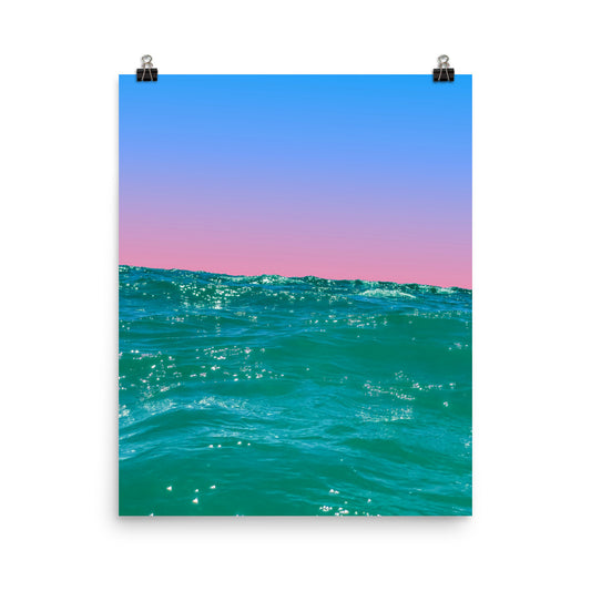 Fine art ocean print showing sunlit teal waves from water level with a soft pink and blue gradient sky — unframed archival print by Nathan Head Photography.