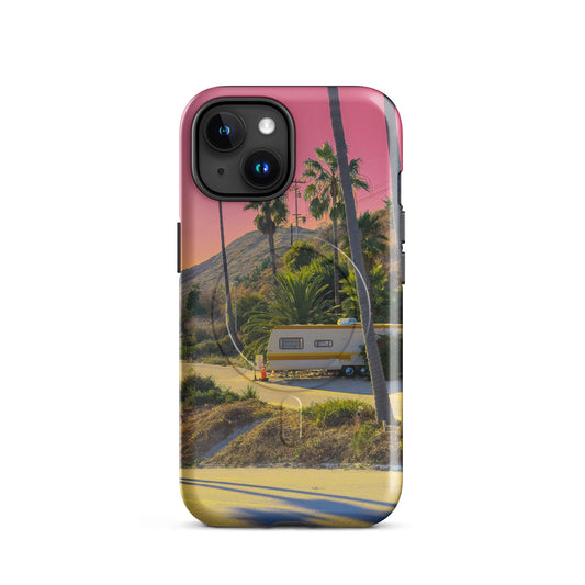 Phone case with a scenic design of palm trees and a sunset.
